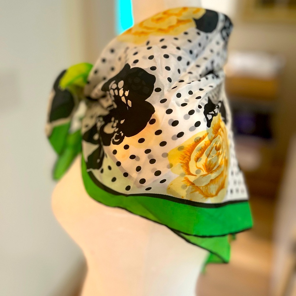 Silk chiffon scarf in green, black, and white with yellow floral pattern.